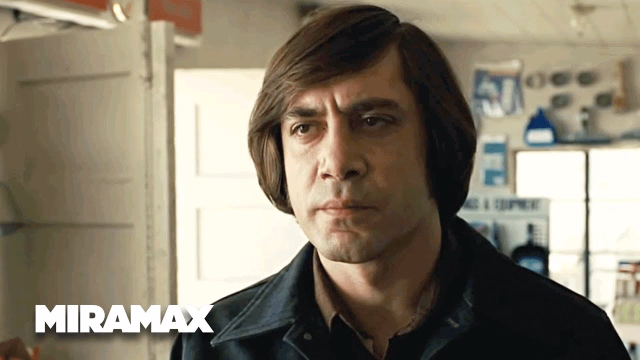 What does the coin toss symbolize in No Country for Old Men?