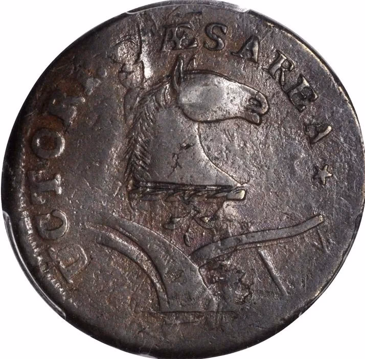 When a copper coin is dipped in silver nitrate solution, a glitter appears on the coin after some time. Why does this happen?