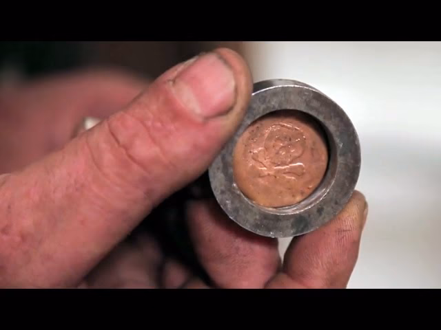 What is a coin press?