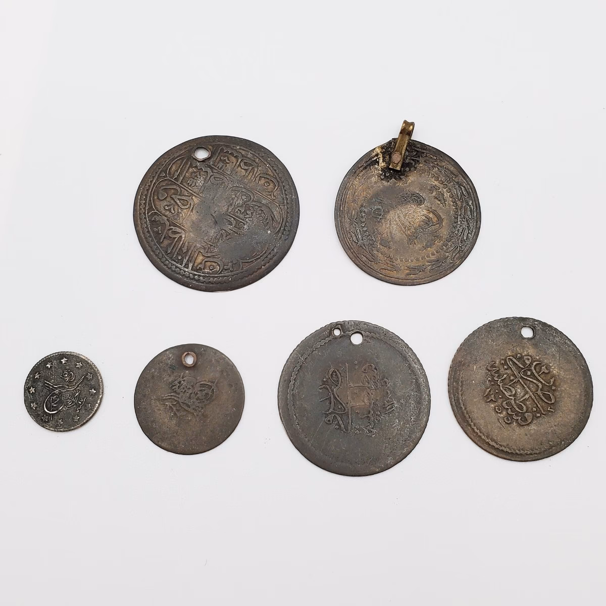 What is a holed coin?