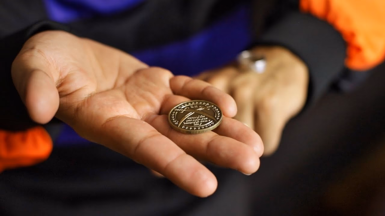 What is the meaning of the money coin ring?