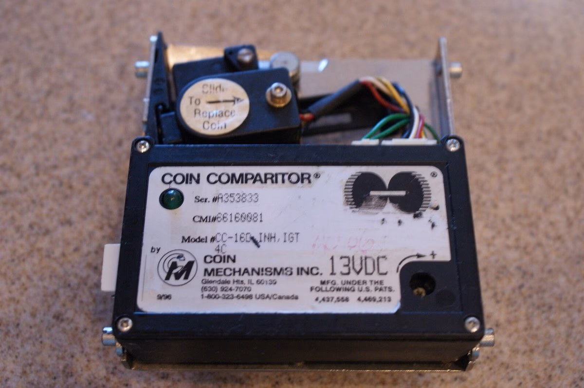 How does a coin comparitor work?
