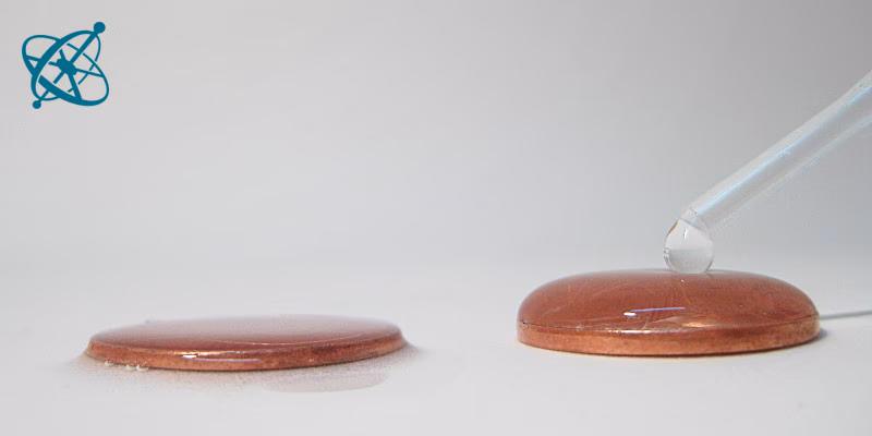 How do you test the surface tension of a coin?